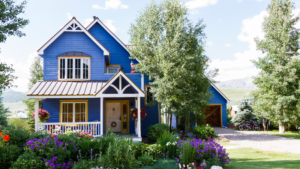 Charming blue Colorado mountain home with vibrant spring landscaping, surrounded by lush greenery and views of the Rockies.
