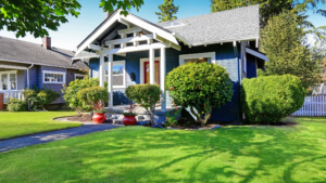 Well-maintained bungalow home with manicured front lawn and fresh exterior paint, ideal for spring home sale prep in Denver or Boulder.