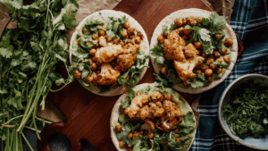 Plant-based flatbread with roasted cauliflower, chickpeas, and fresh cilantro – a sustainable and vegan-friendly dish